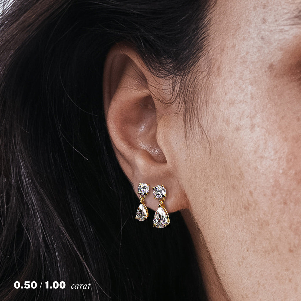 עגיל יהלומים נופל טיפה טבעי זהב צהוב 14K על אוזן אישה
